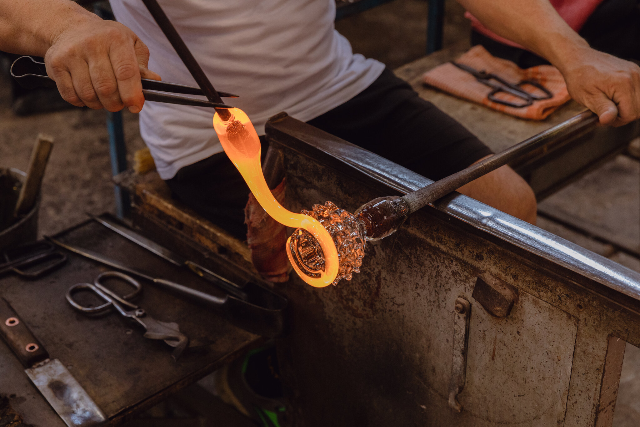 Hand-blown Murano glass glowing with intricate designs 